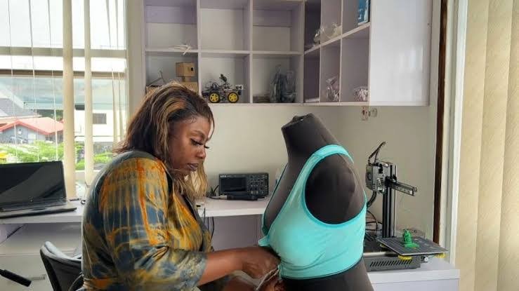 Kemisola Bolarinwa, Founder of Nextwear works on a wearable Bra.