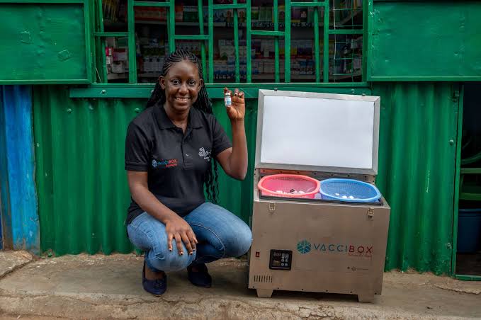 Norah Magero, co-Founder and CEO of Drop Access displays a vaccine from VaccineBox.